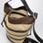 Borsa a secchiello Loop in rafia cioccolato/naturale