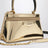 Trousse Antigona dorée en cuir effet miroir
