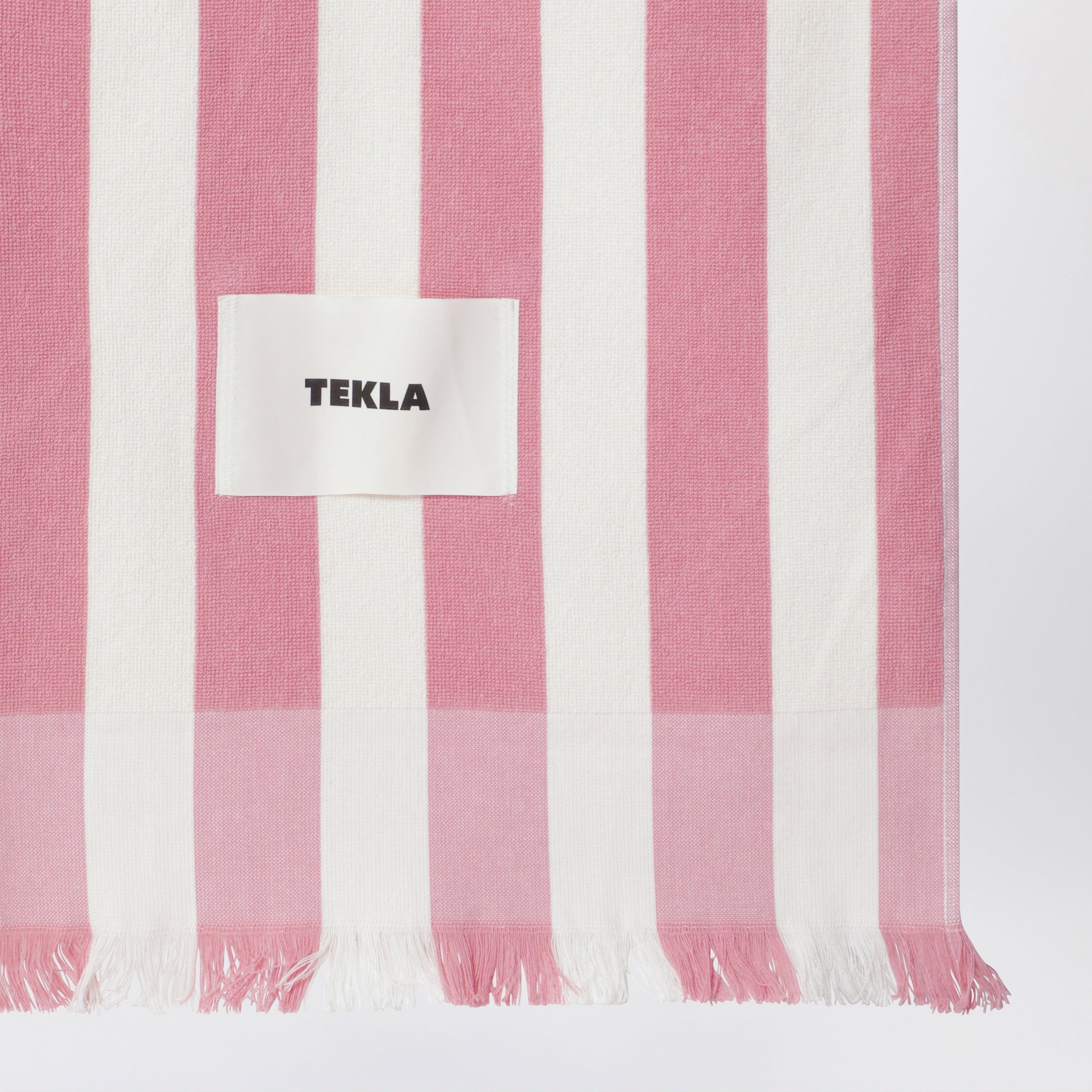 Pink/white striped beach towel