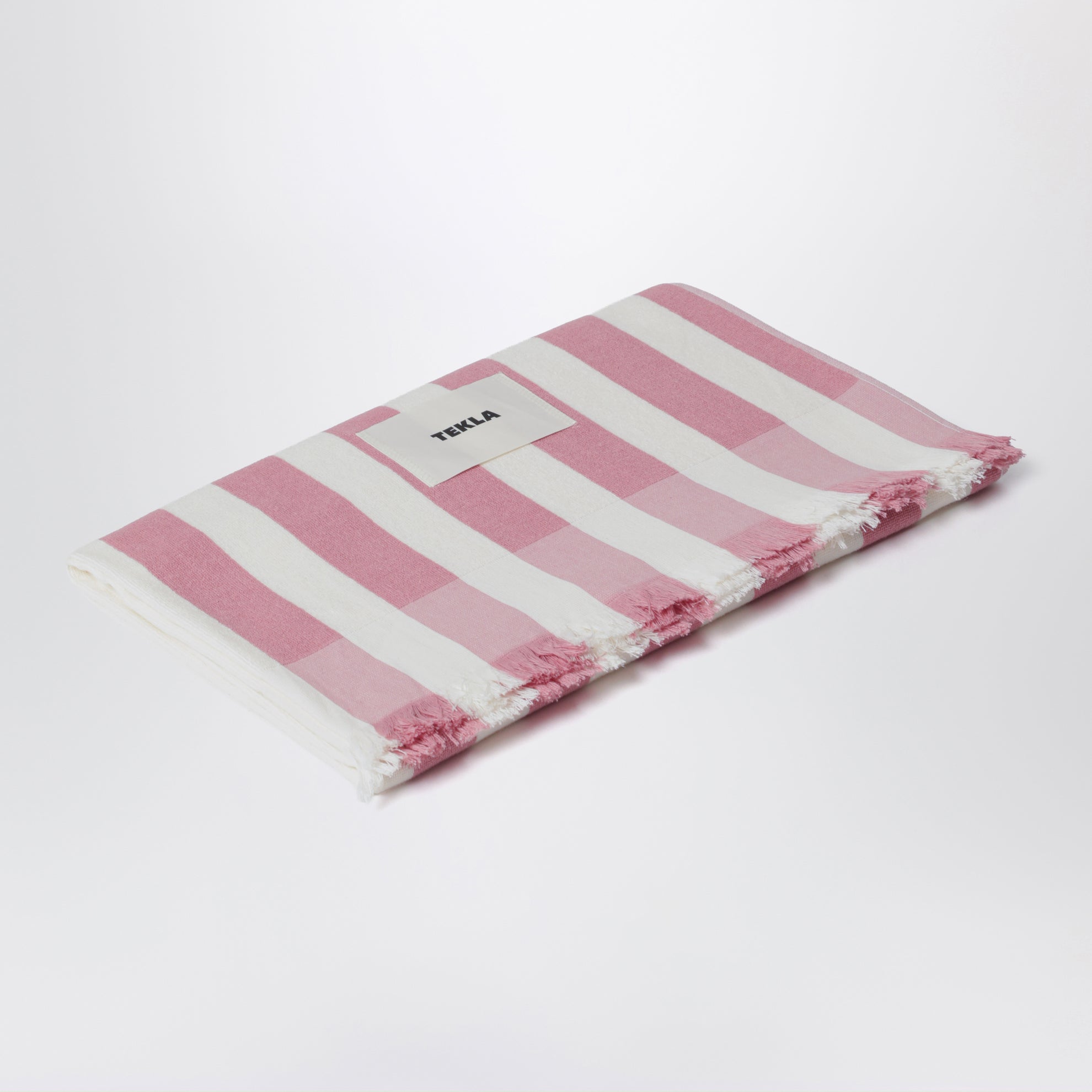 Pink/white striped beach towel
