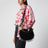 Borsa Oskan Soft Zipped in suede nera con medaglie