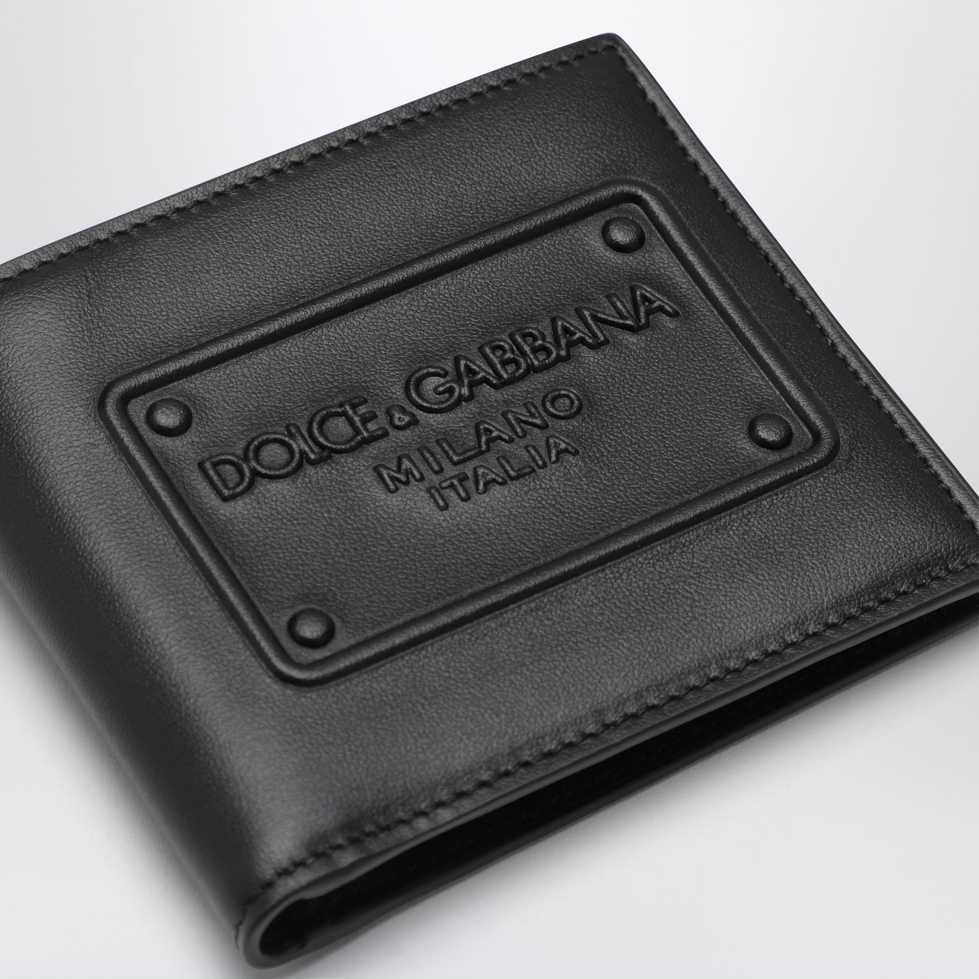 Black bi-fold wallet with embossed logo