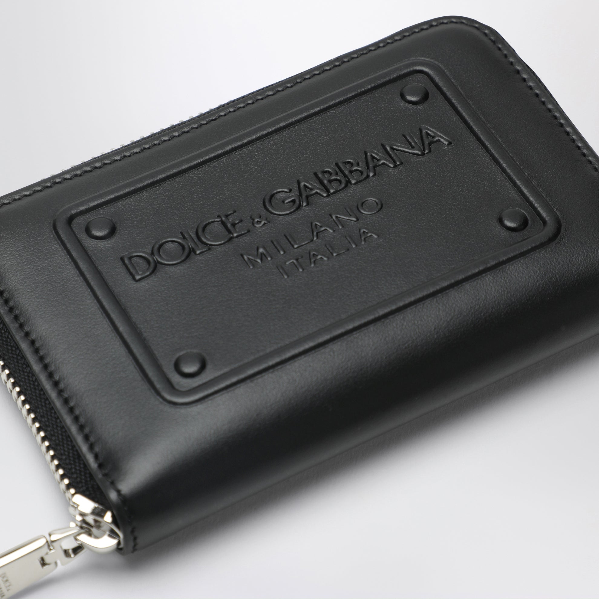 Small black zip-around wallet with embossed logo