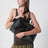 Brioche Duffle Bag in Black Pebble-Grained Leather