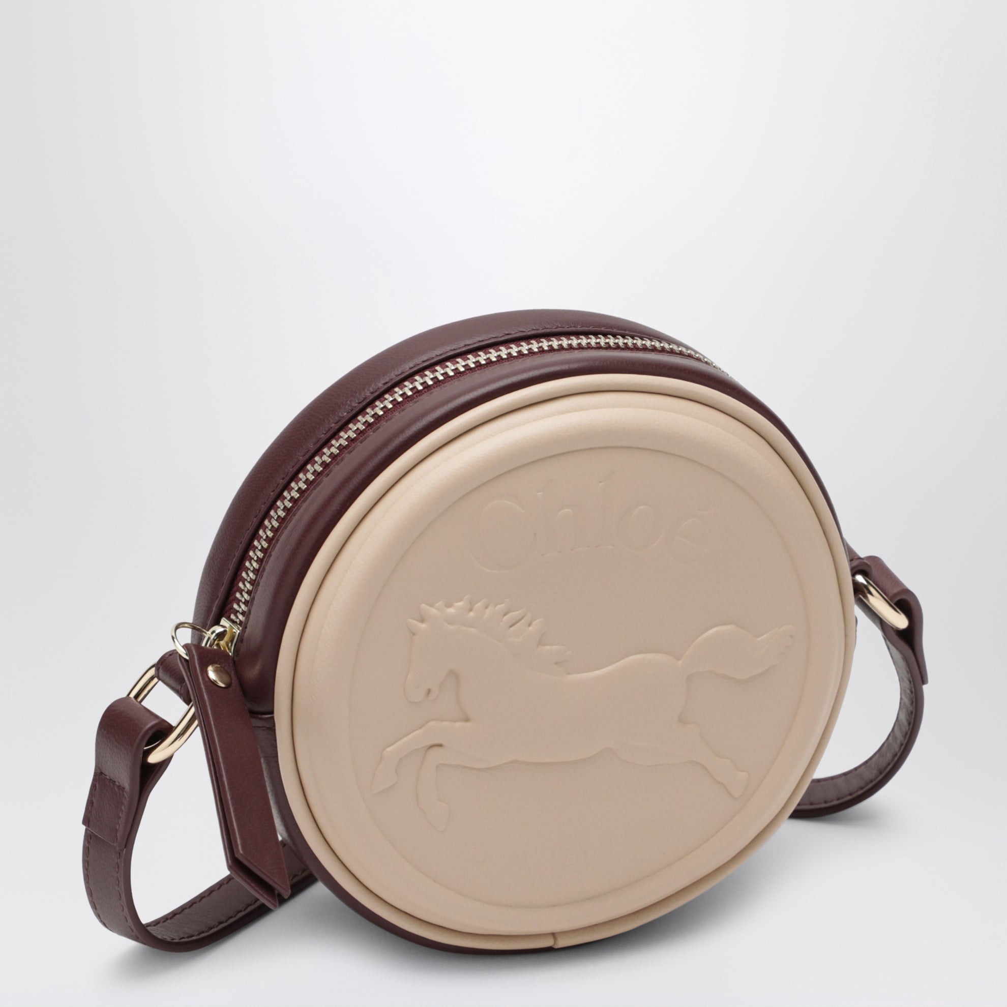 Sac à bandoulière circulaire rose clair en cuir