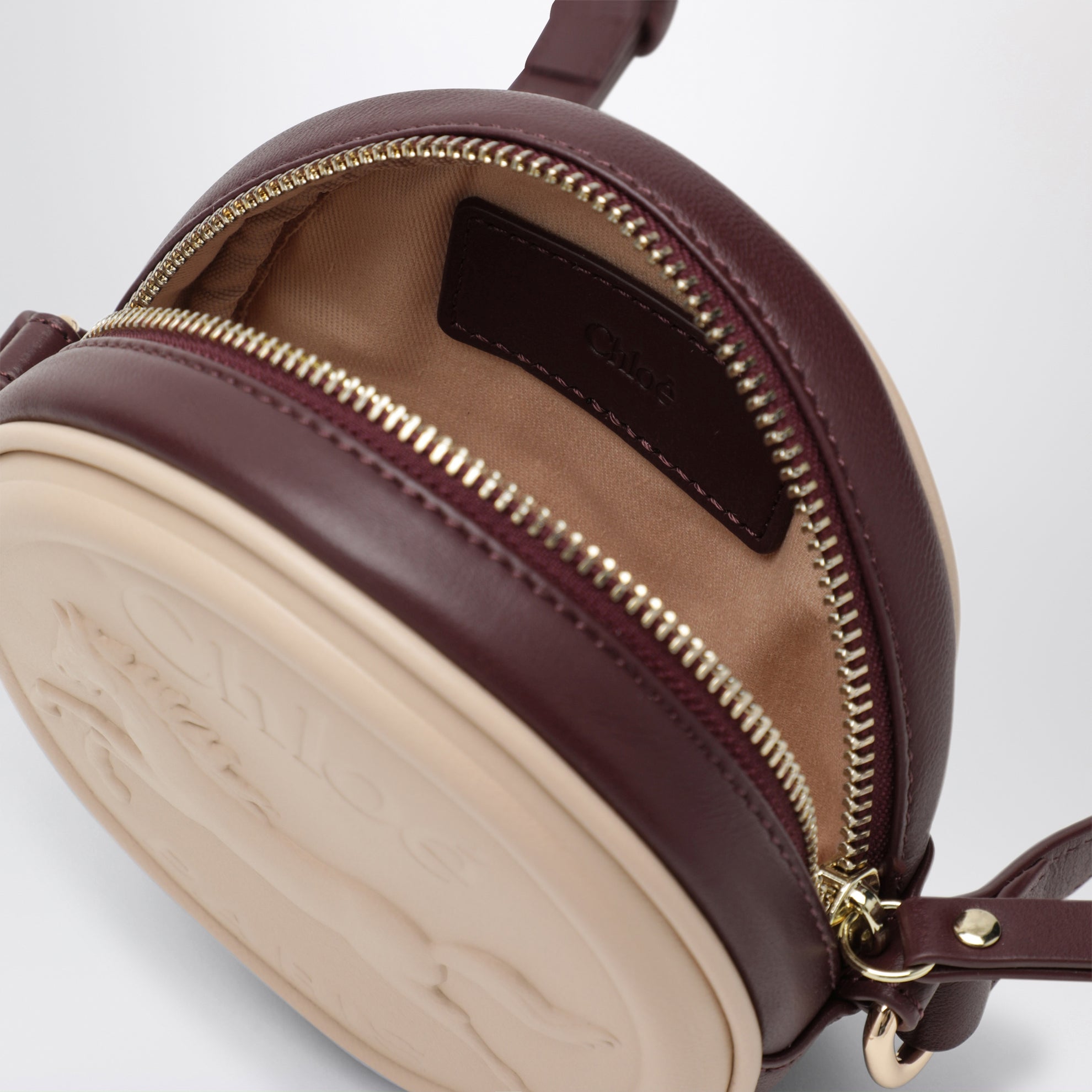 Sac à bandoulière circulaire rose clair en cuir