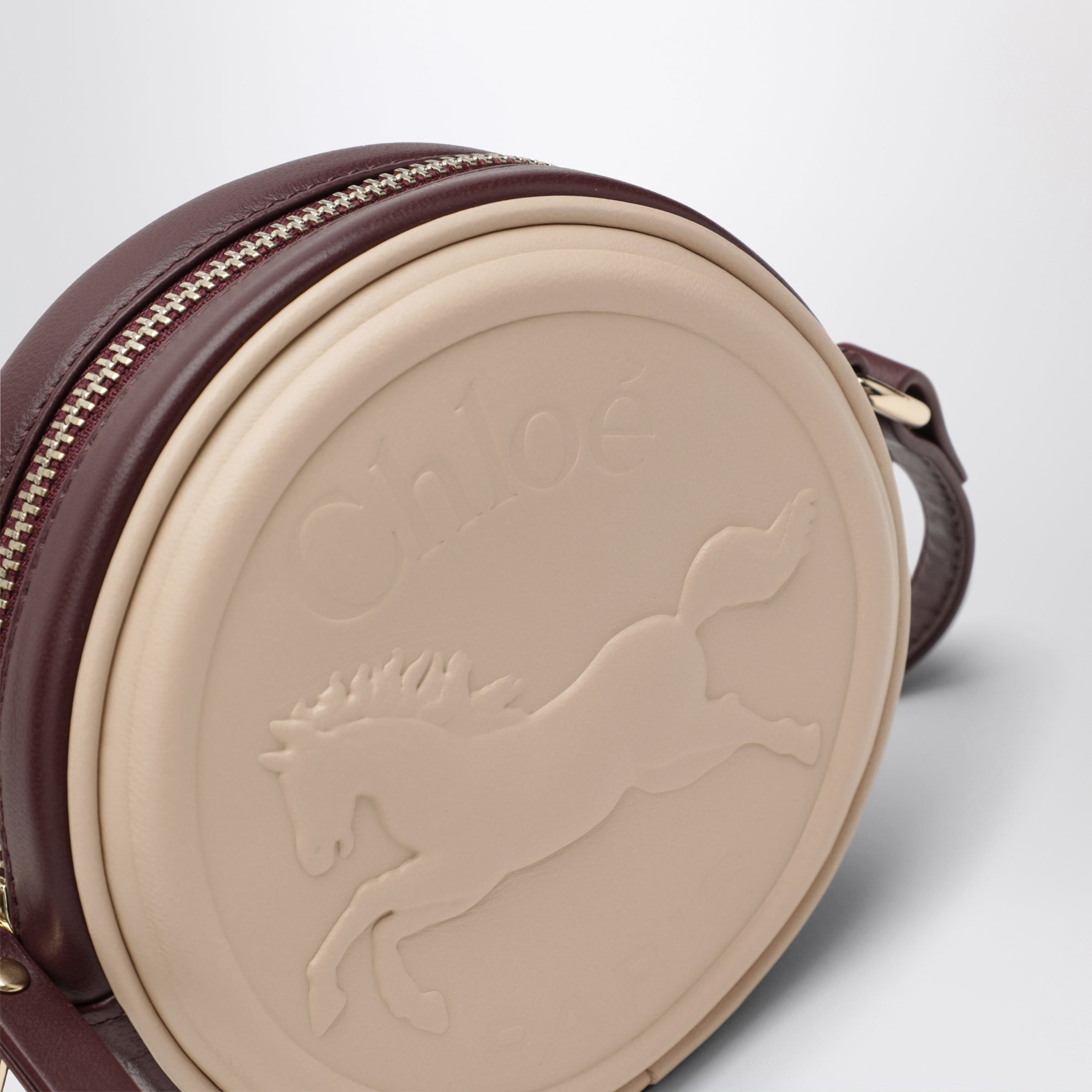 Sac à bandoulière circulaire rose clair en cuir