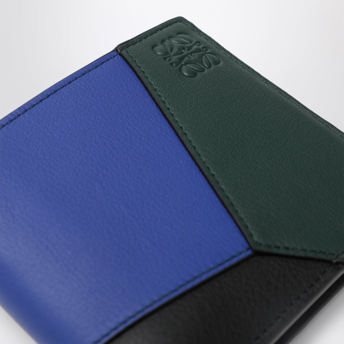 Puzzle black and blue bifold wallet in calfskin