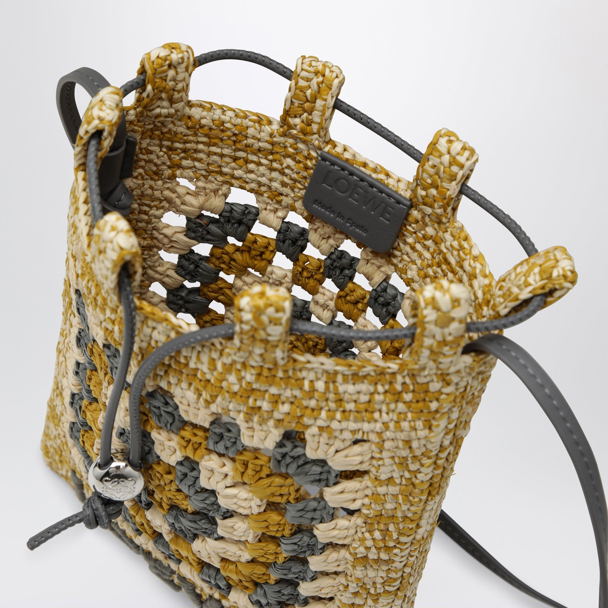 Pearl grey/mustard raffia and leather drawstring pouch