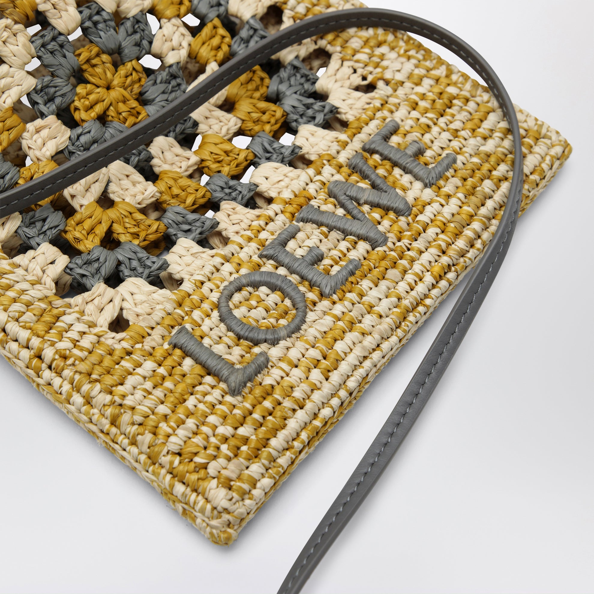 Pearl grey/mustard raffia and leather drawstring pouch