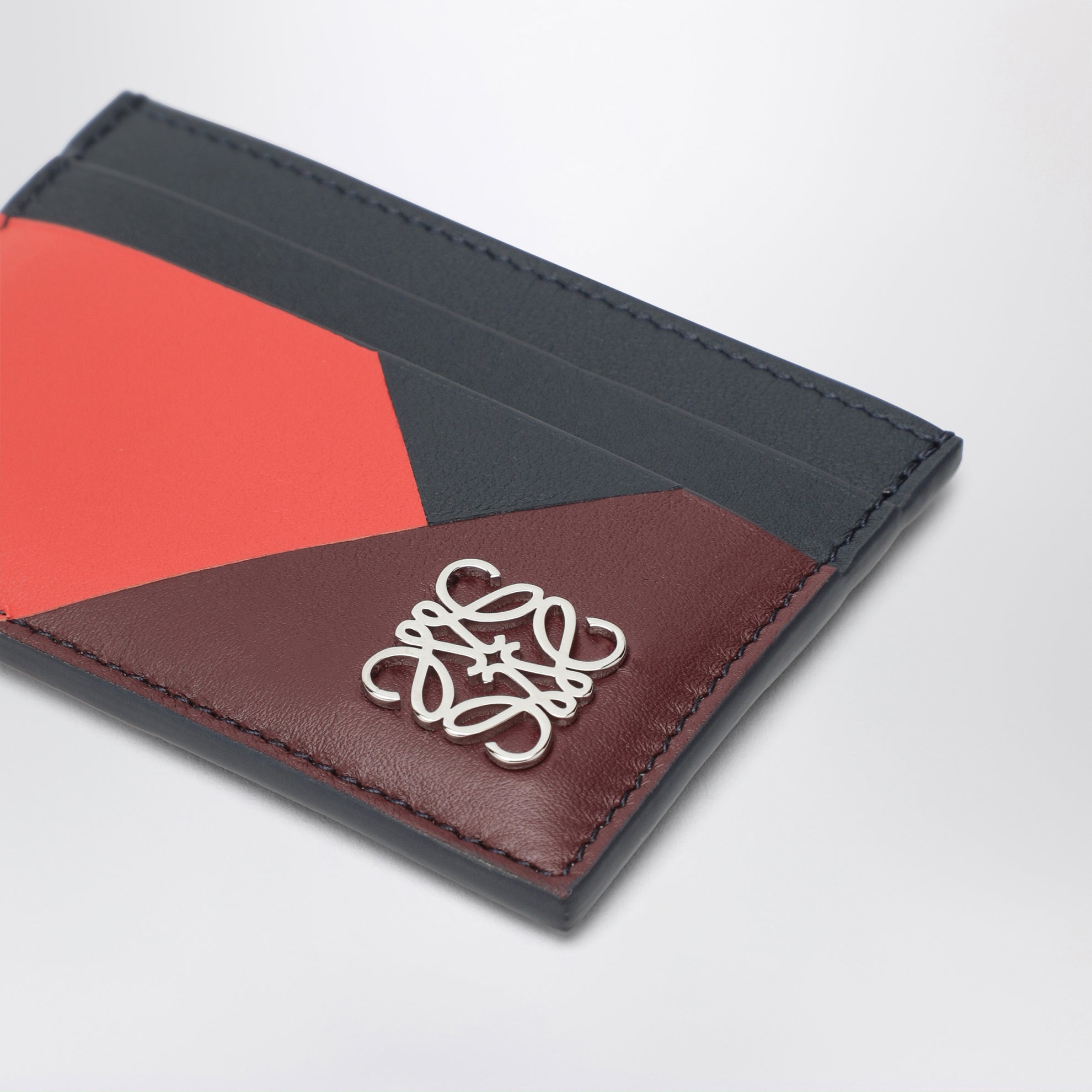 Anagram card holder with multicolour graphic motifs