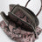 Black and mauve La Passeggiata Mini handbag in python-effect leather