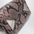 Black and mauve La Passeggiata Mini handbag in python-effect leather