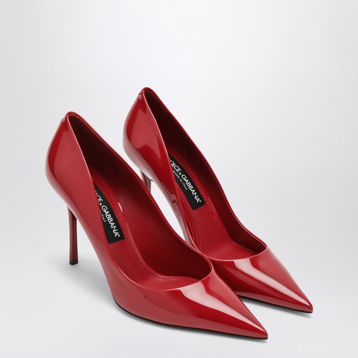 Red patent leather pumps