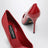 Red patent leather pumps