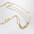 Gold-tone belt with logo lettering