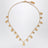 Collana Paddington con charm in ottone oro
