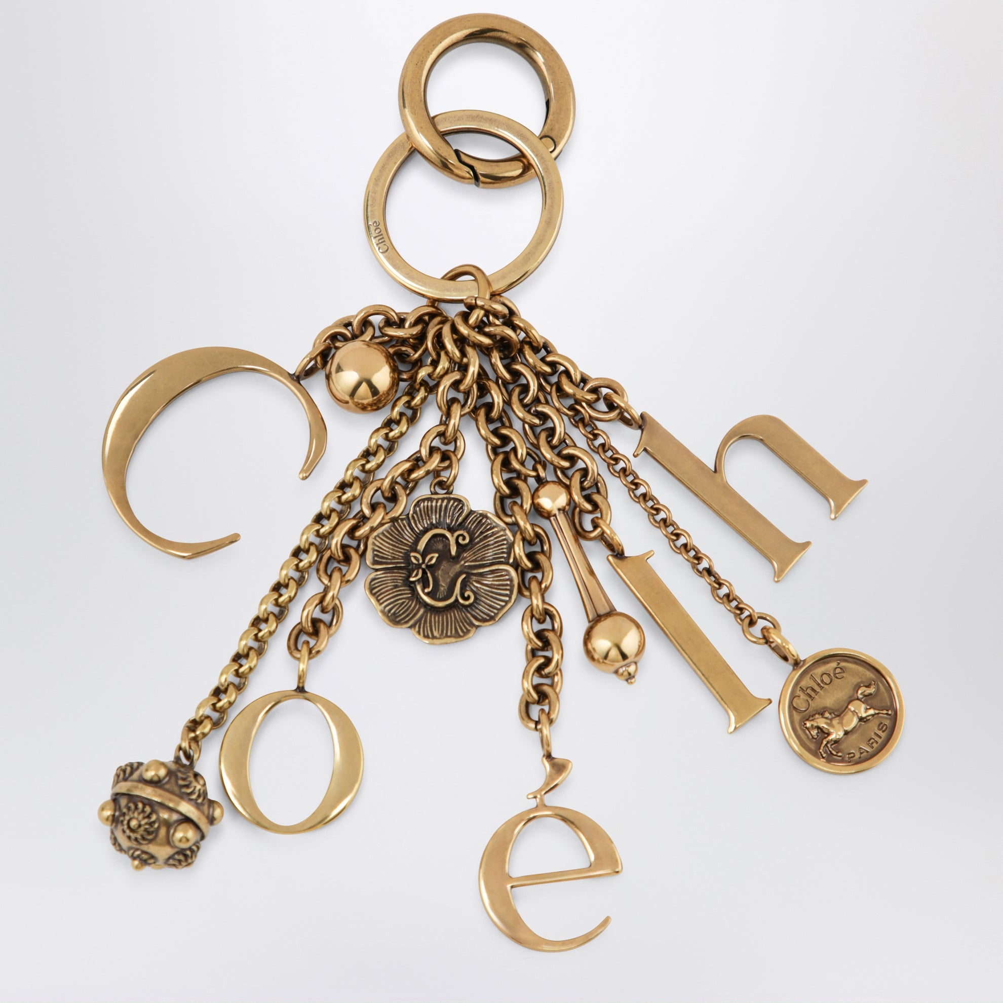 Charm portachiavi Symbols Logo in ottone oro
