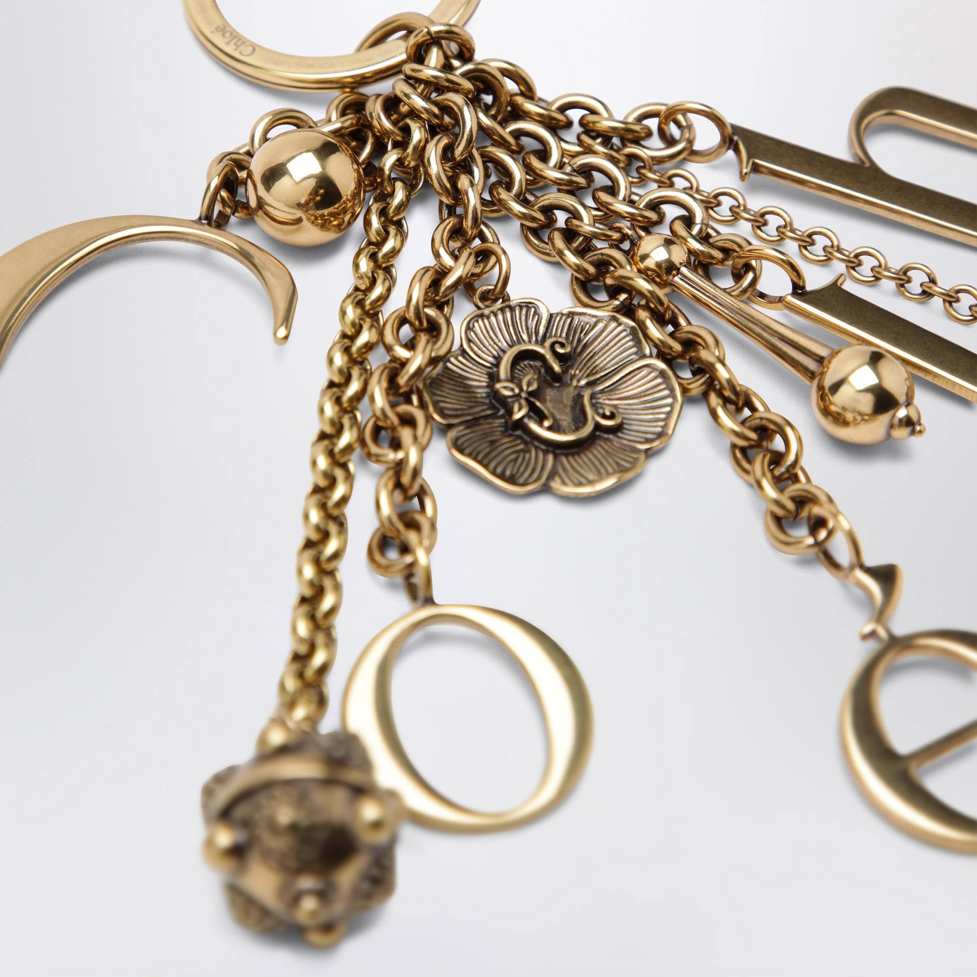 Charm portachiavi Symbols Logo in ottone oro