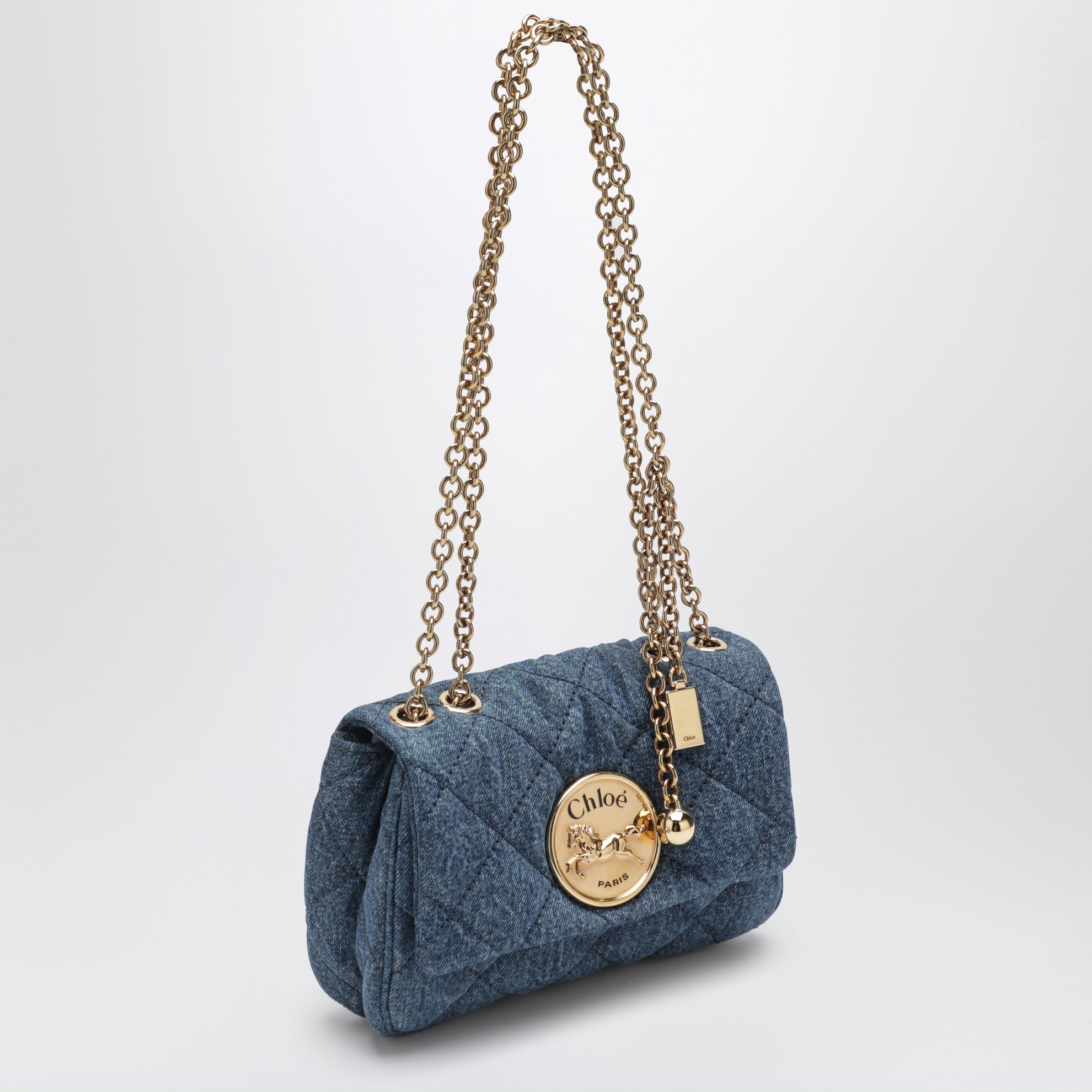 Heritage small quilted denim shoulder bag in blue