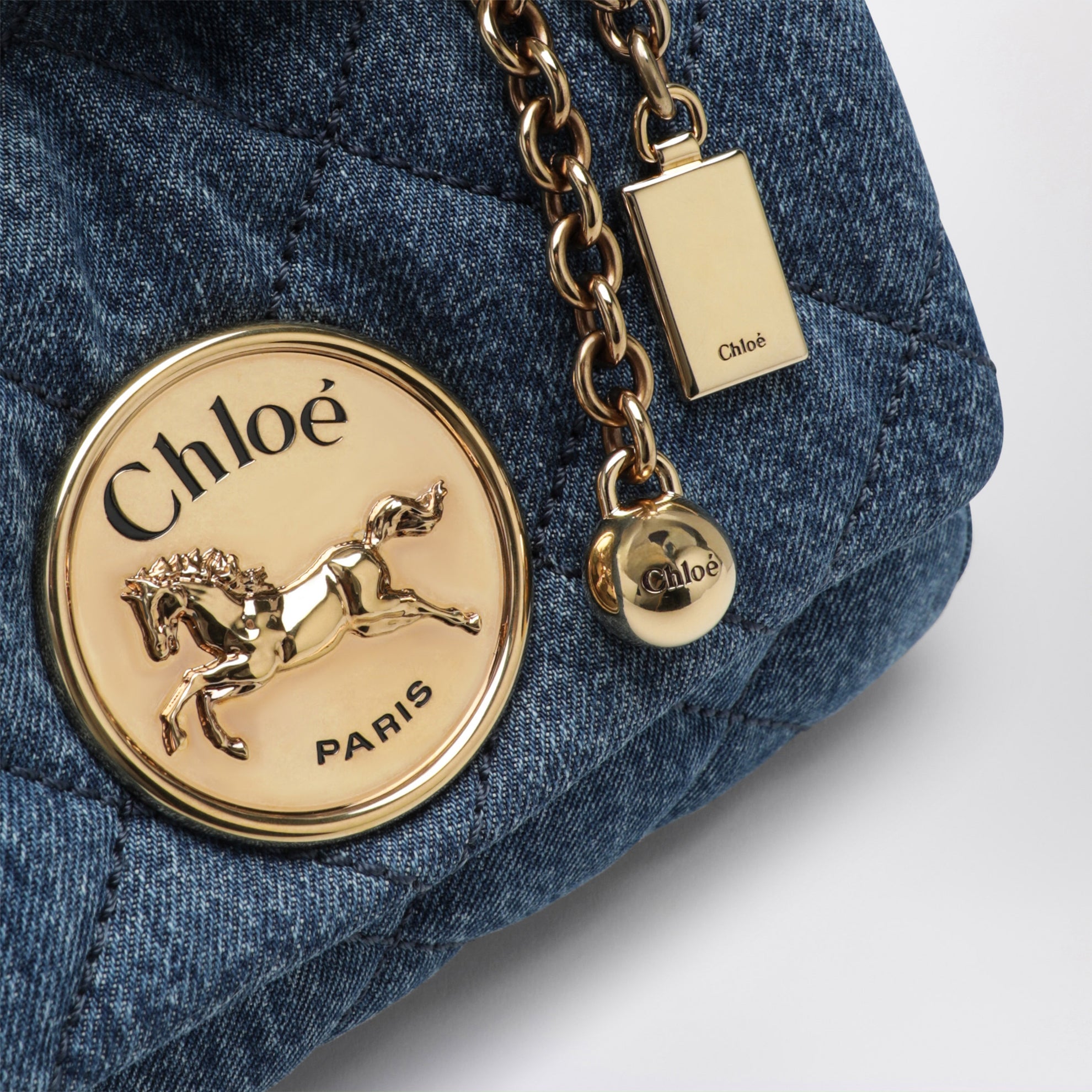 Heritage small quilted denim shoulder bag in blue