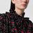 Schwarze Bluse mit Volants aus Seide mit Blumenprint