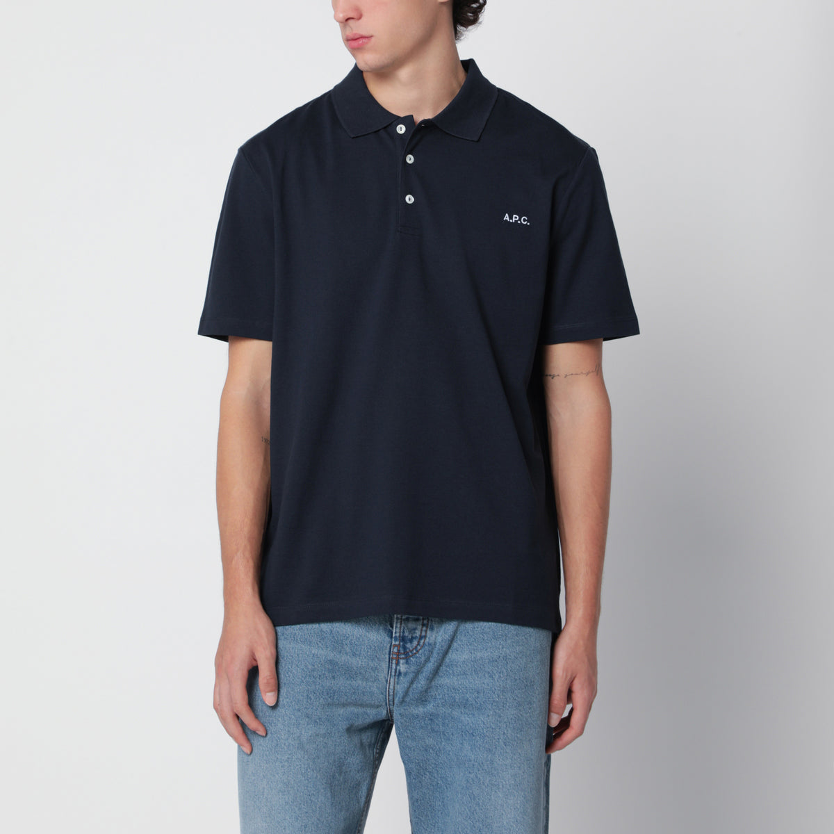 Polo blu scura in cotone con ricamo logo