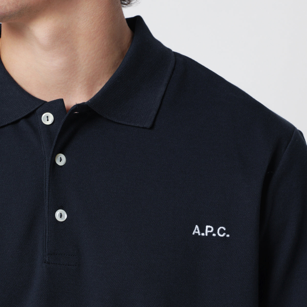 Polo blu scura in cotone con ricamo logo