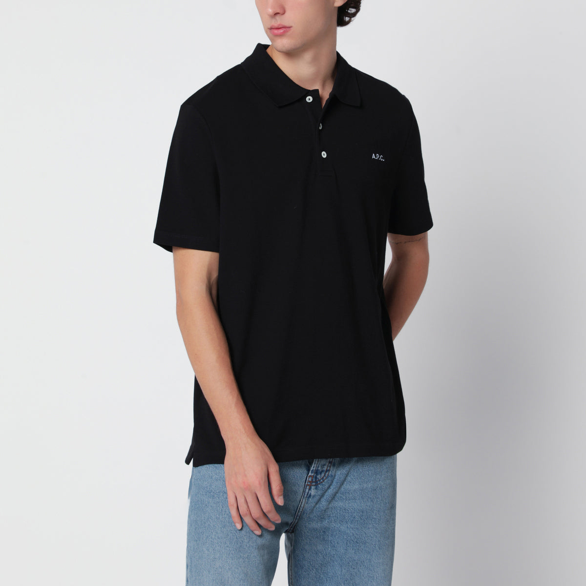 Polo nera in cotone con ricamo logo