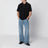 Polo nera in cotone con ricamo logo