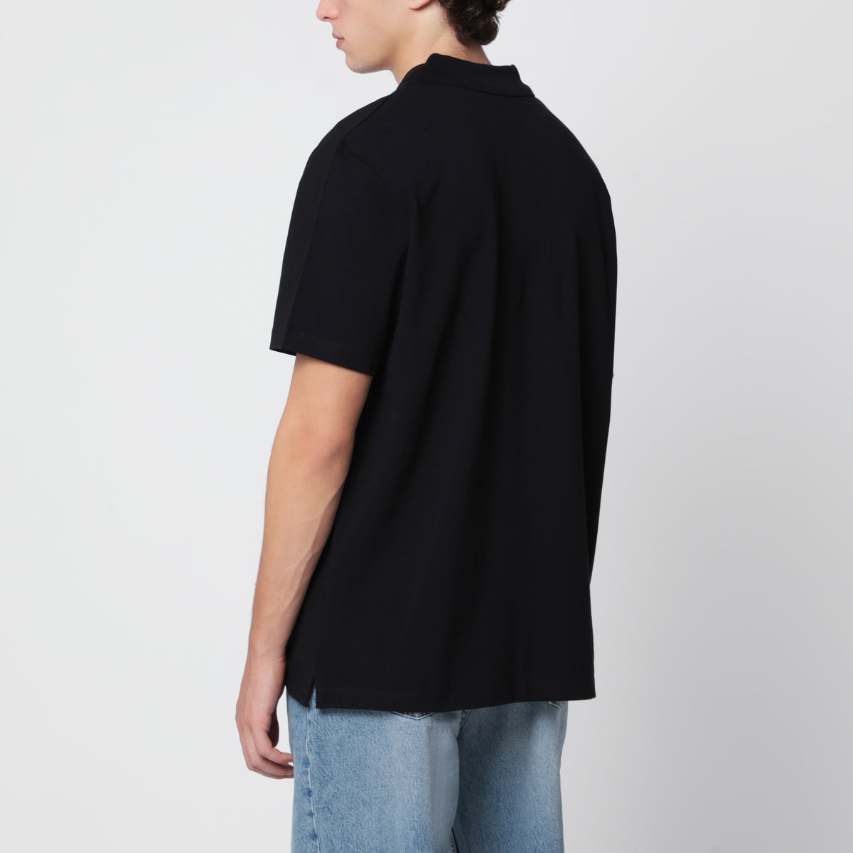 Polo nera in cotone con ricamo logo