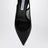 Schwarze Pumps mit Schleife aus Netzstoff