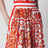 Plisseerock aus Baumwollpopeline mit Maiolica-Print in Orange