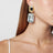 Boucles d’oreilles à clip en métal doré avec cristal pendant
