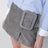 Grey suede mini skirt with large buckle belt