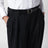 Pantalon noir ceinturé à motif rayures tennis