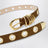 Ceinture marron en daim avec œillets métalliques