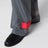 Pantaloni grigi/rossi in tessuto con finitura lucida