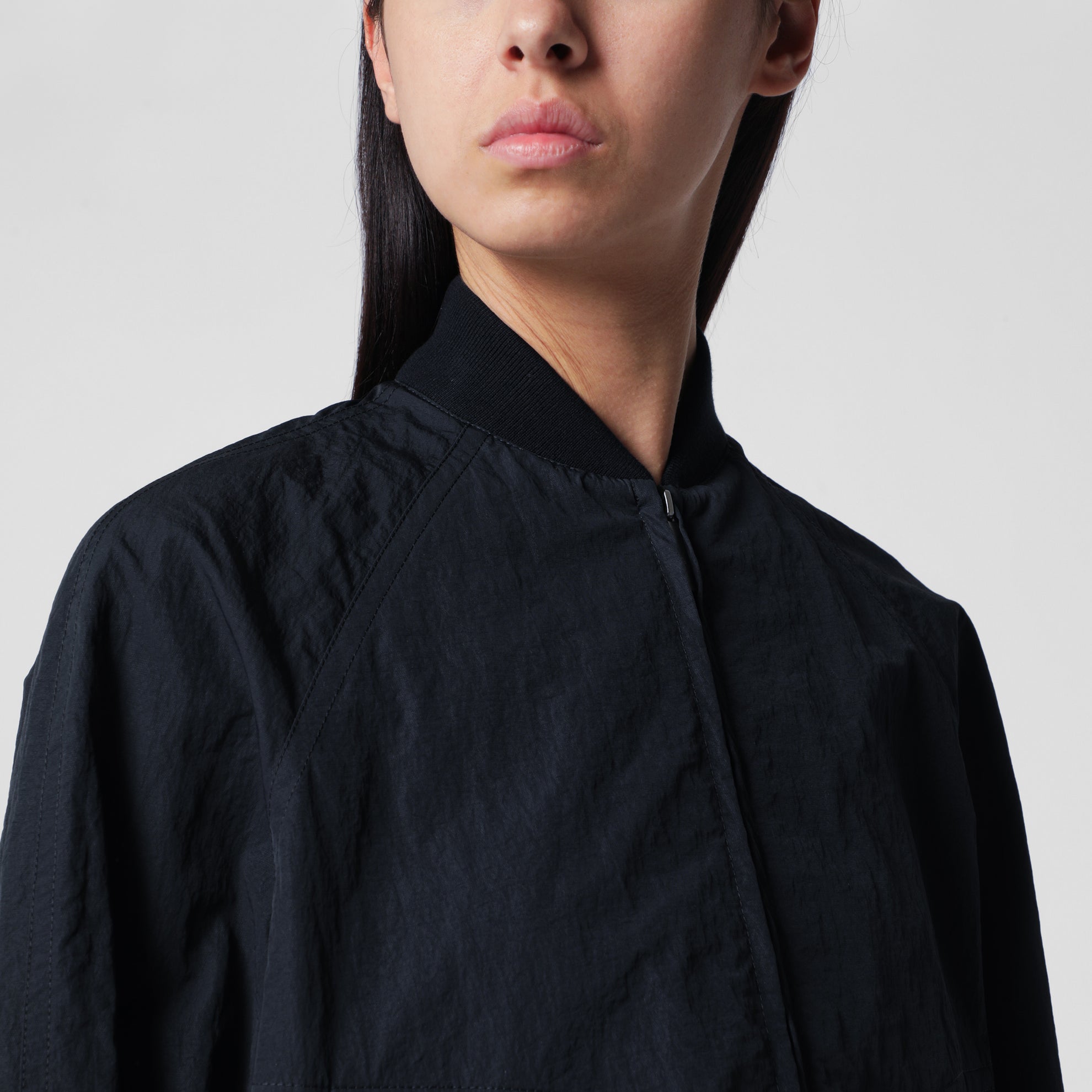 Blue zip-up nylon jacket