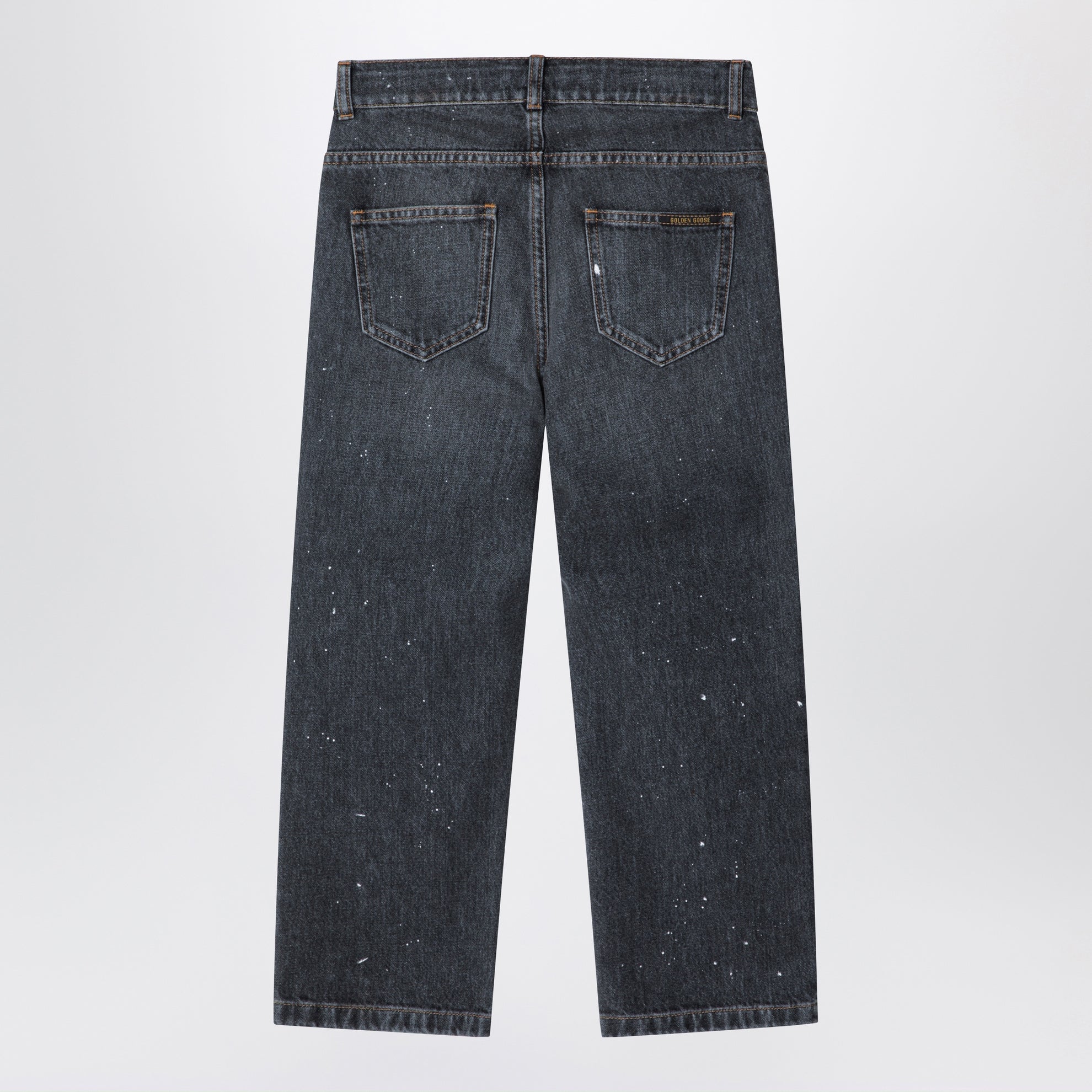 Jeans nero in denim slavato con schizzi