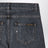 Jeans nero in denim slavato con schizzi