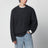 Grauer Pullover aus Boucléwolle