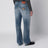 Jeans blu effetto slavato con placca logo