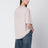 Pink T-shirt with reversed logo lettering on the back
