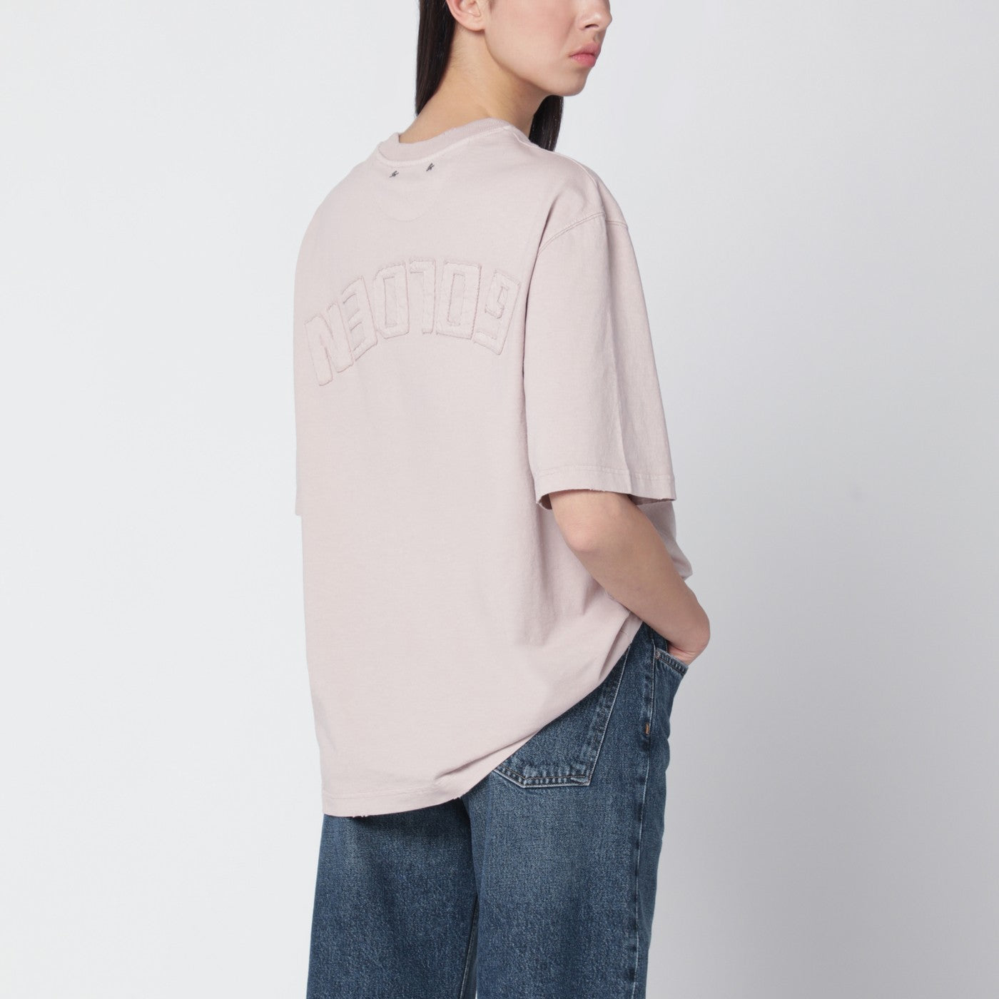 Pink T-shirt with reversed logo lettering on the back