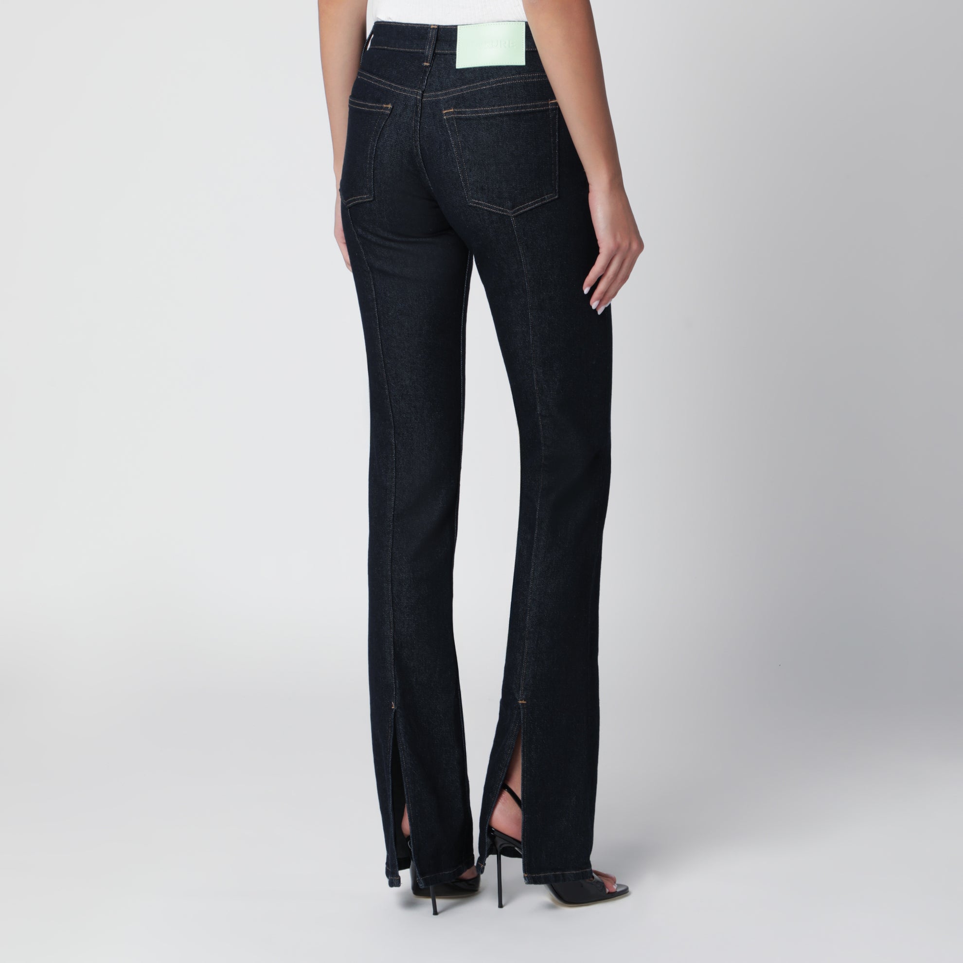 Dark blue jeans with slits