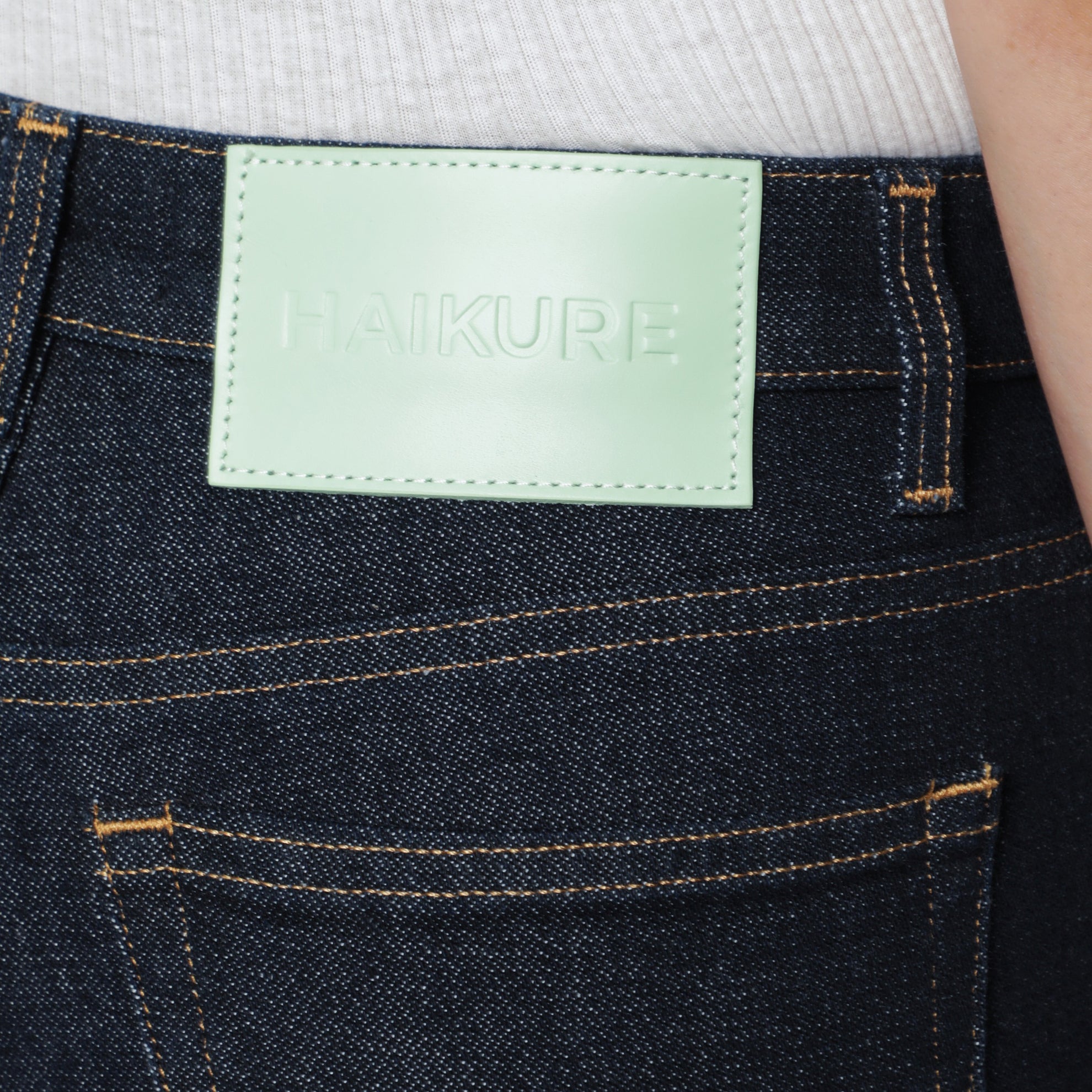 Dark blue jeans with slits