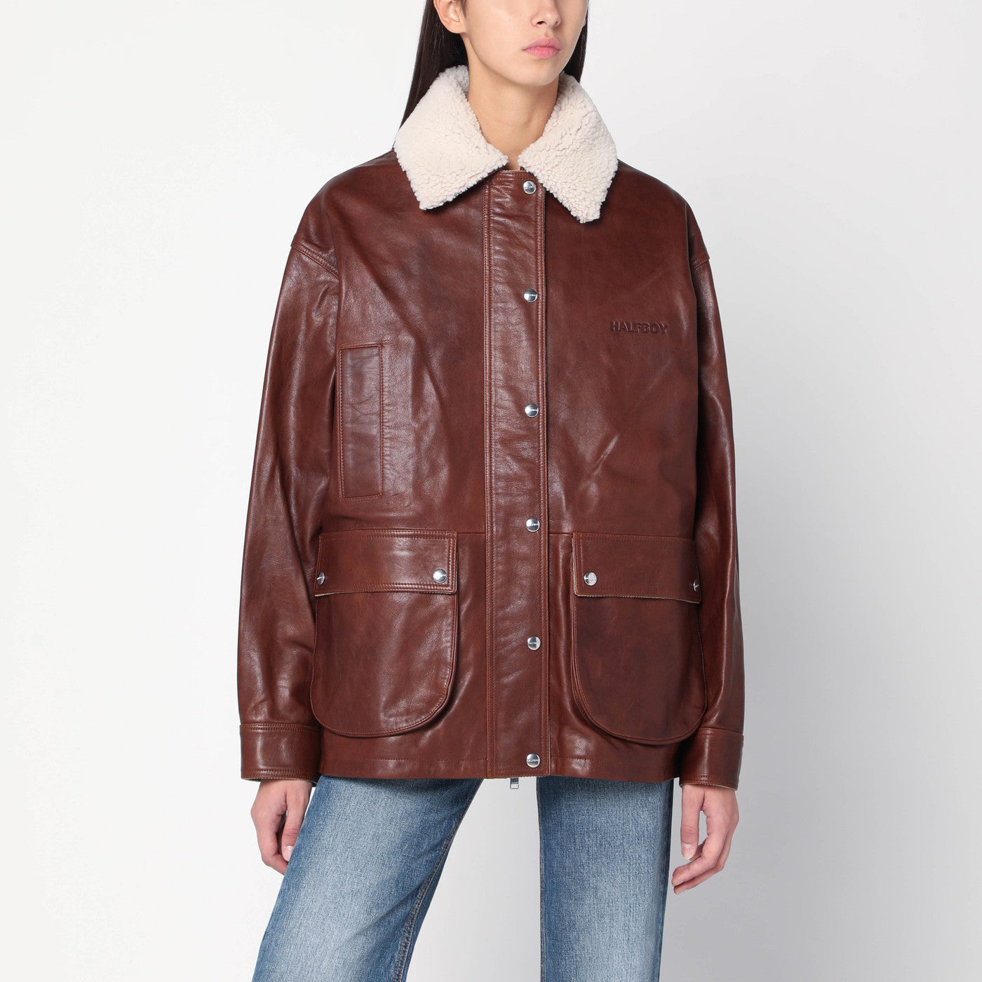 Giubbotto marrone in pelle con collo in shearling