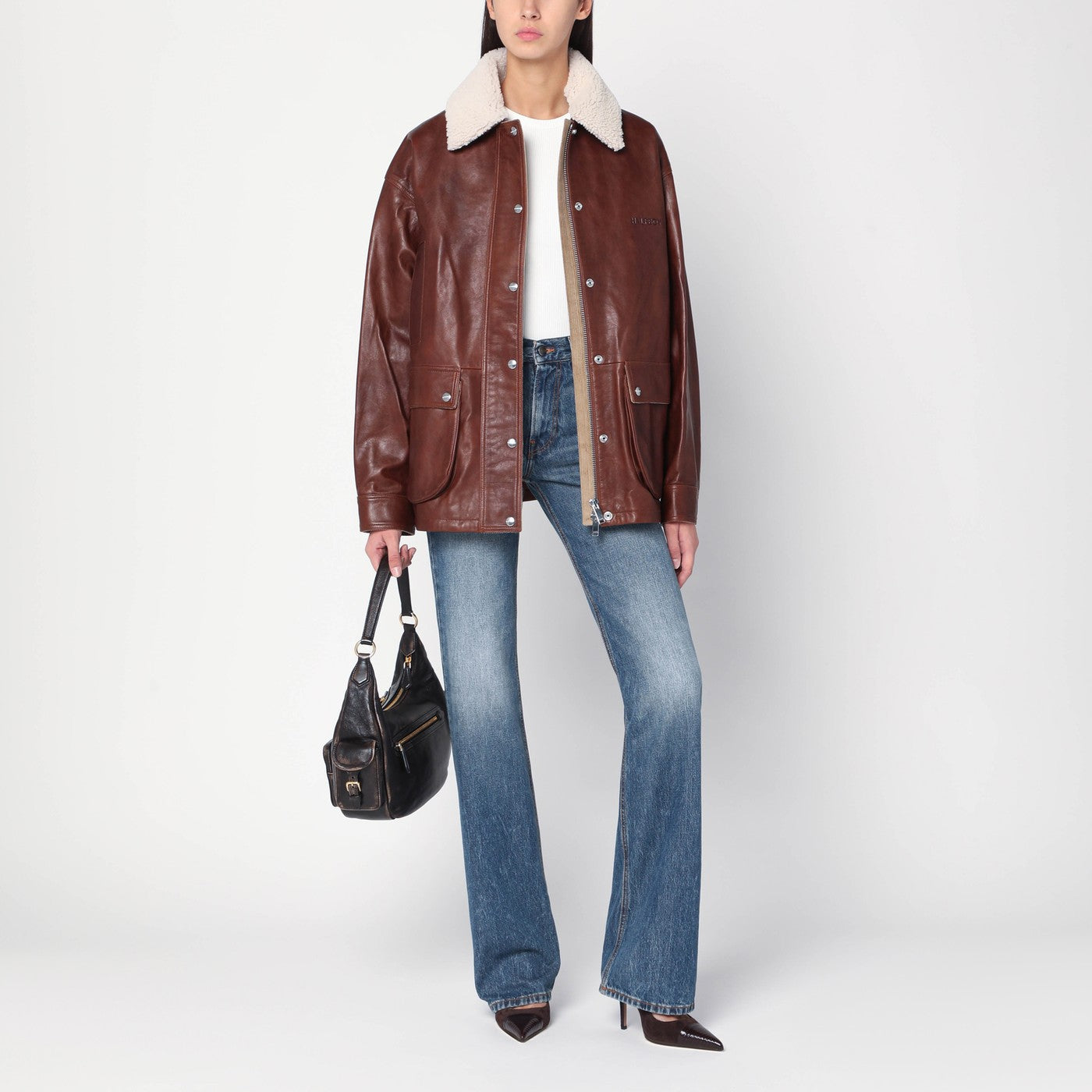 Giubbotto marrone in pelle con collo in shearling