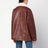 Giubbotto marrone in pelle con collo in shearling